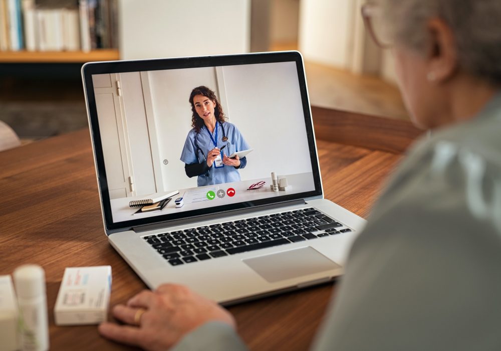 Senior woman in video tele medicine call with doctor